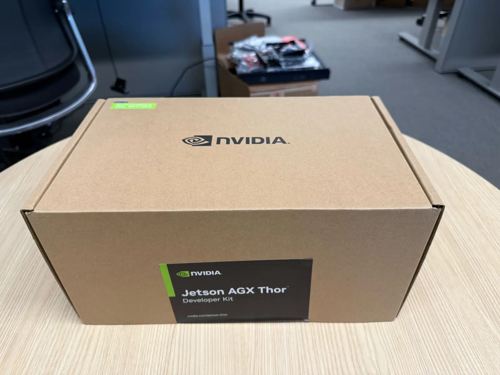 Closed NVIDIA Jetson AGX Thor Developer Kit box on a round table